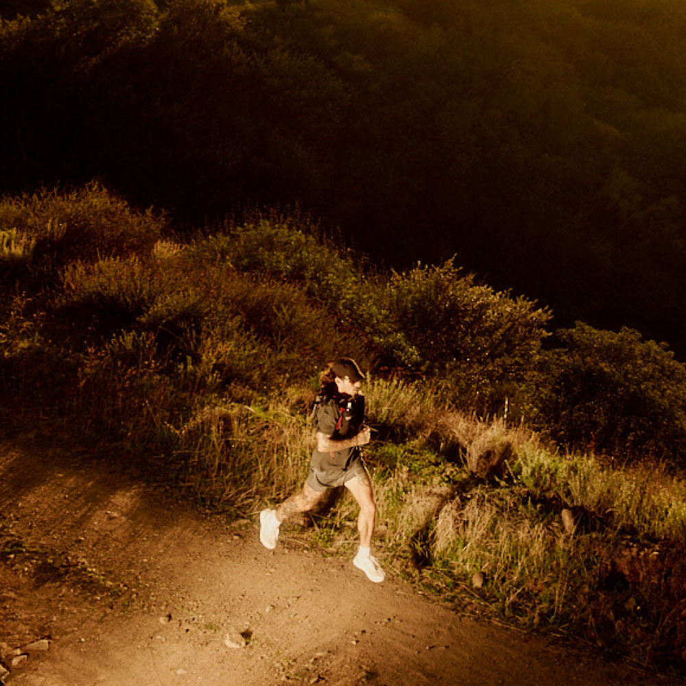 A man running with a camelbak pack